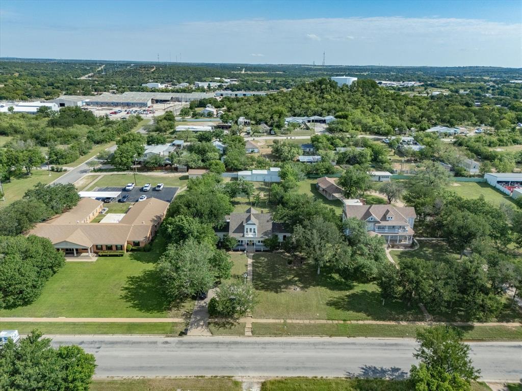 907 4th Street Graham, TX 76450 - Photo 34 of 34 an aerial view of a houses with a yard and lake view