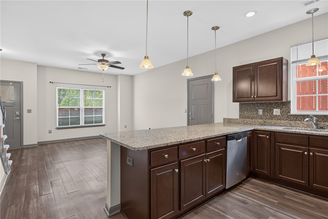 235 Pendleton Road, Unit K1 Clemson, SC 29631 - Photo 20 of 49 Granite counters and rich cabinetry define this inviting kitchen and living area.