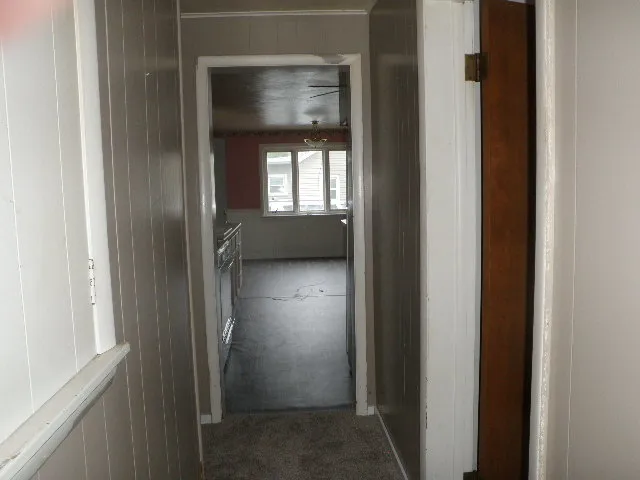 a view of a bathroom from a corridor