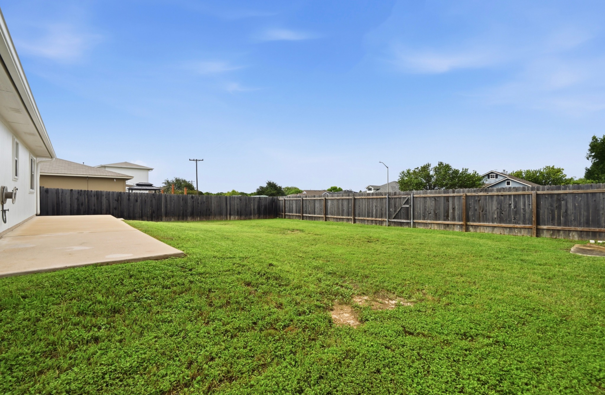 112 Mason Reed Cove Kyle, TX 78640 - Photo 26 of 26 a view of a backyard with grass