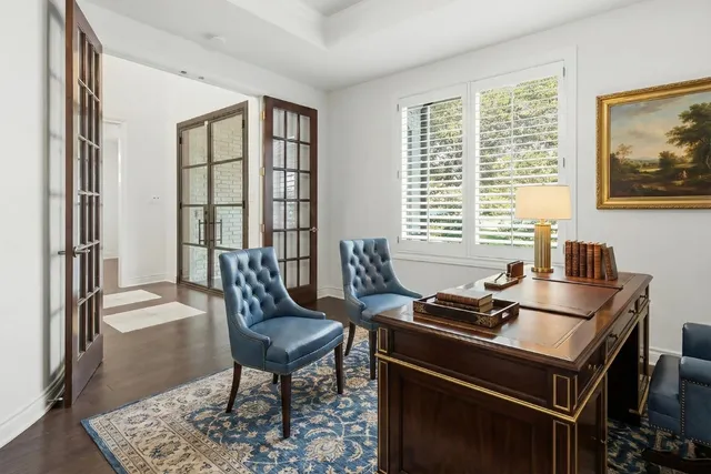 a dining room with furniture and windows