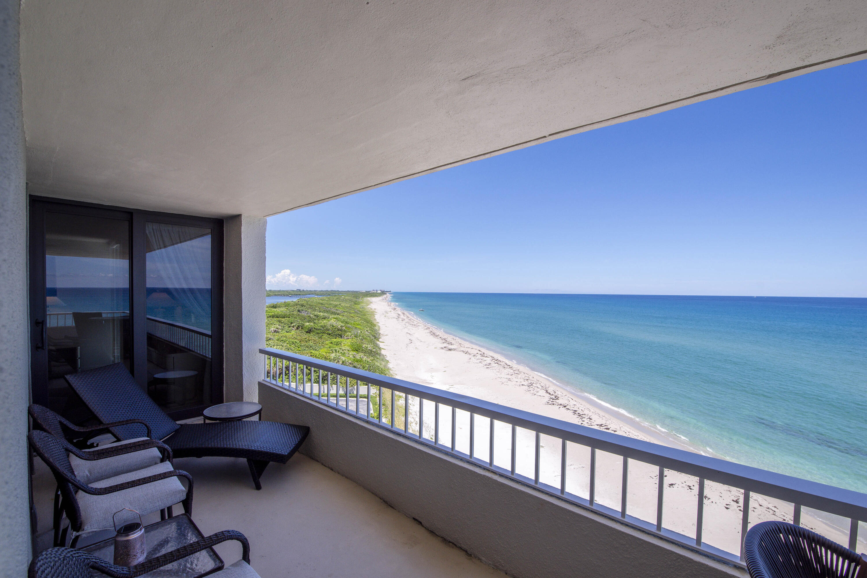 a view of a living room and floor to ceiling window