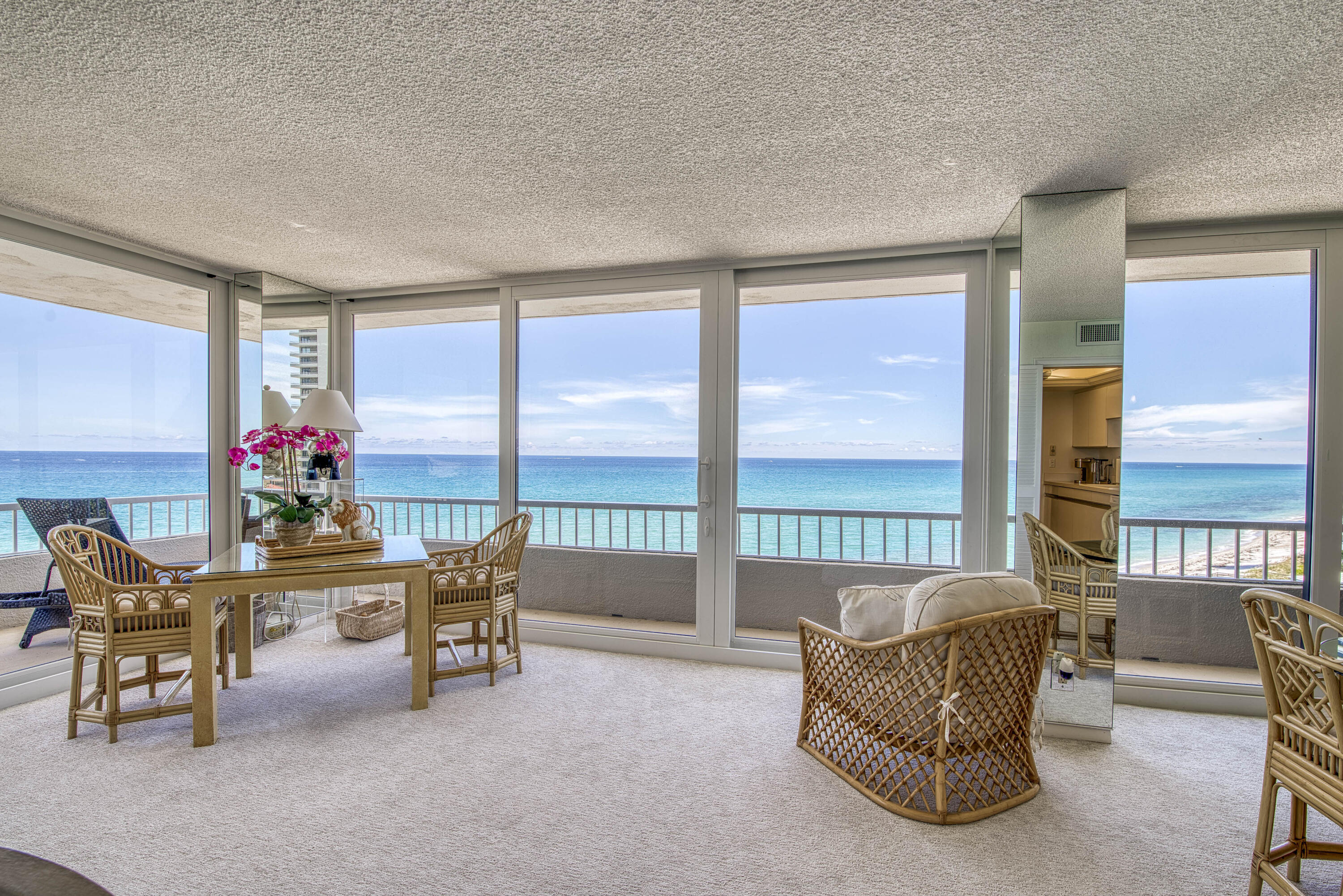 5540 North Ocean Drive, Unit 7A Singer Island, FL 33404 - Photo 11 of 26 a living room with furniture and a floor to ceiling window