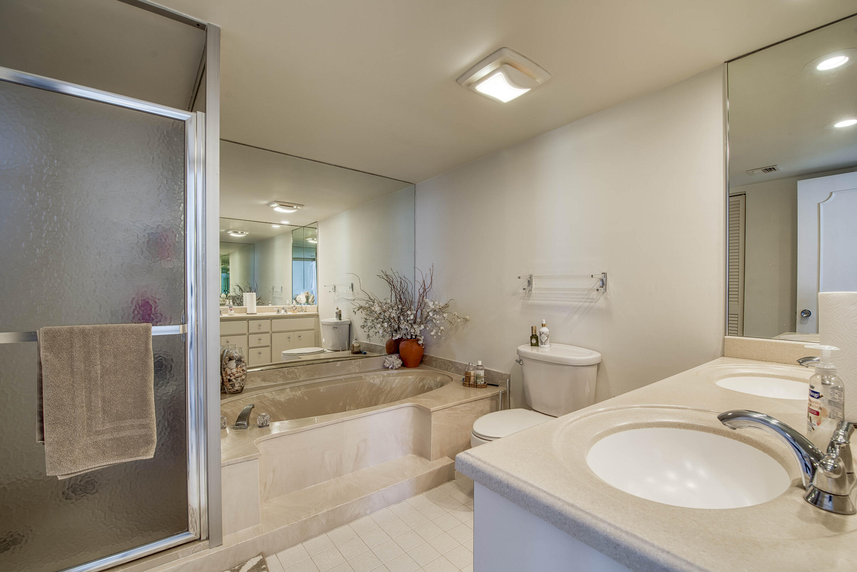 5540 North Ocean Drive, Unit 7A Singer Island, FL 33404 - Photo 23 of 26 a bathroom with a granite countertop sink and a mirror