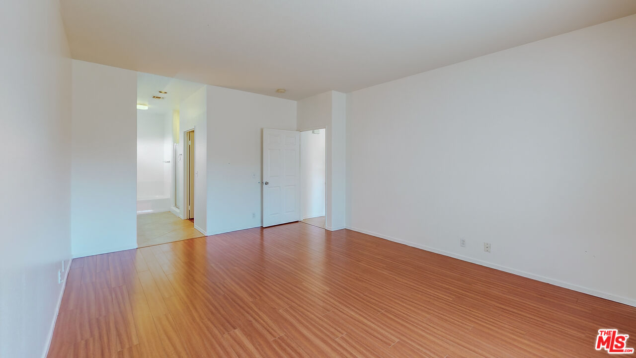 68606 La Medera Road Cathedral City, CA 92234 - Photo 14 of 33 a view of an empty room with wooden floor
