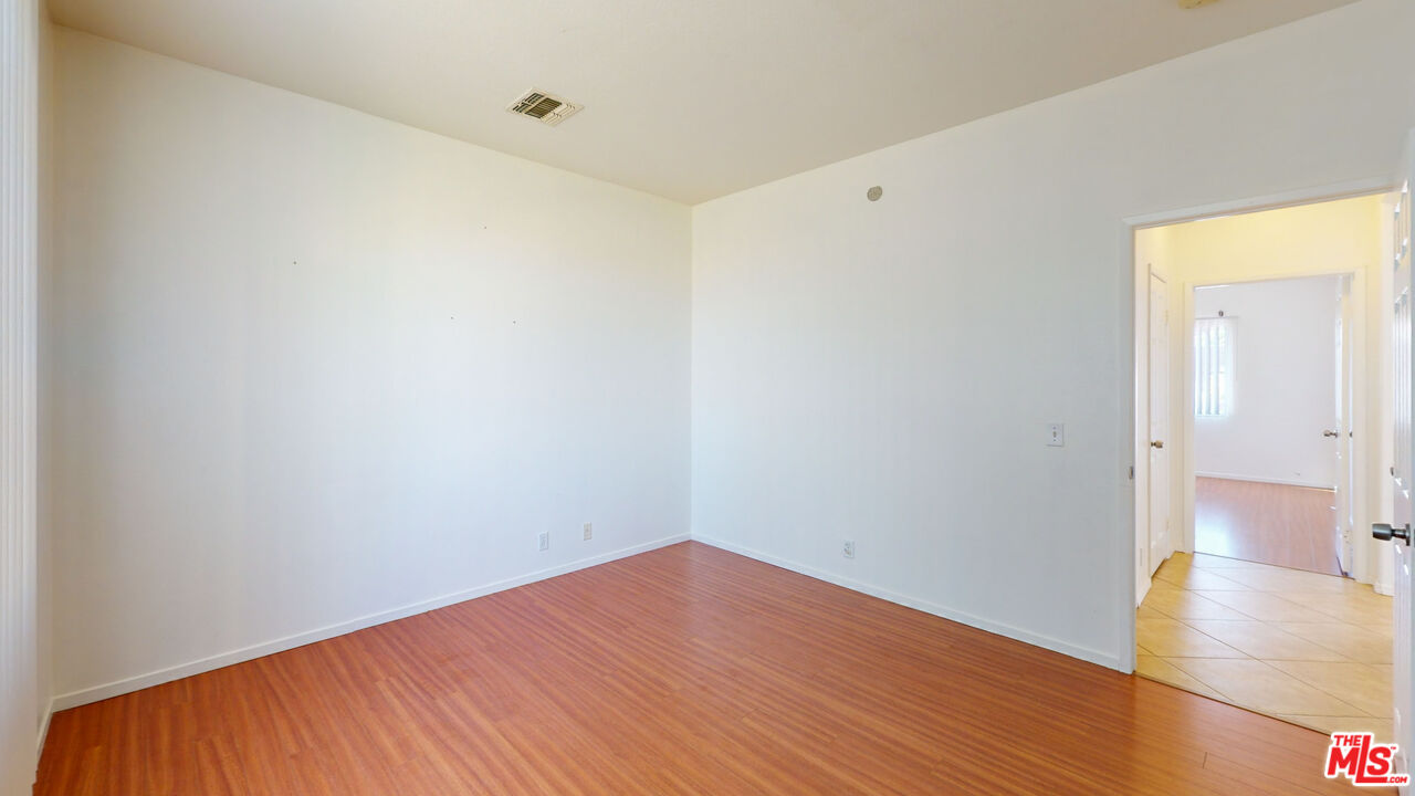 68606 La Medera Road Cathedral City, CA 92234 - Photo 20 of 33 a view of a room with wooden floor and white walls