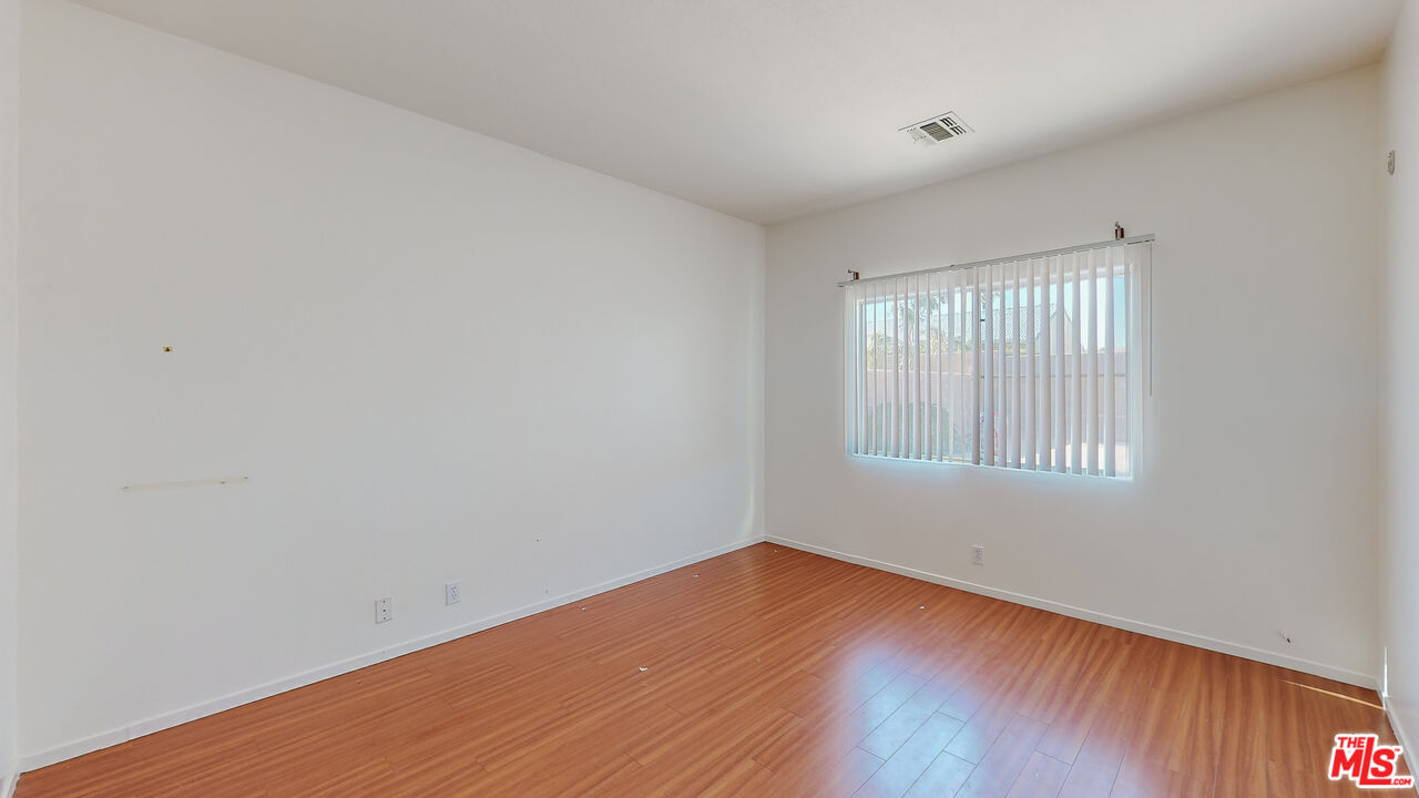 68606 La Medera Road Cathedral City, CA 92234 - Photo 23 of 33 a view of an empty room with wooden floor and a window