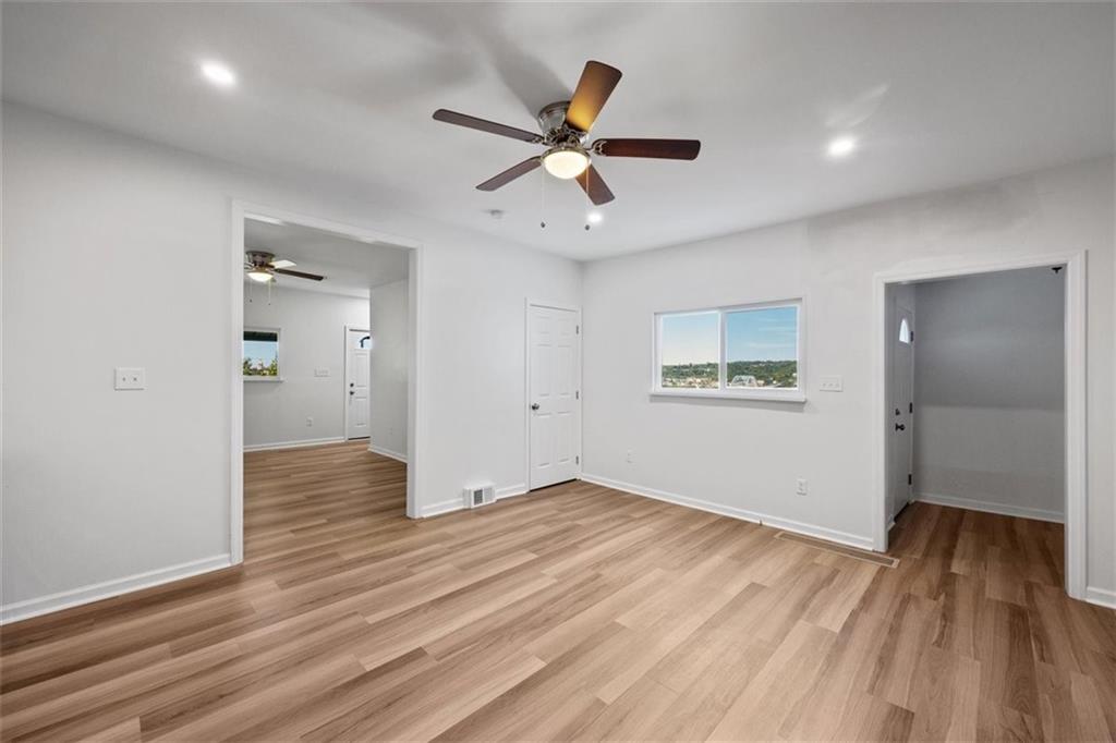 39 Eleanor Street Pittsburgh, PA 15203 - Photo 11 of 25 wooden floor in an empty room with a window