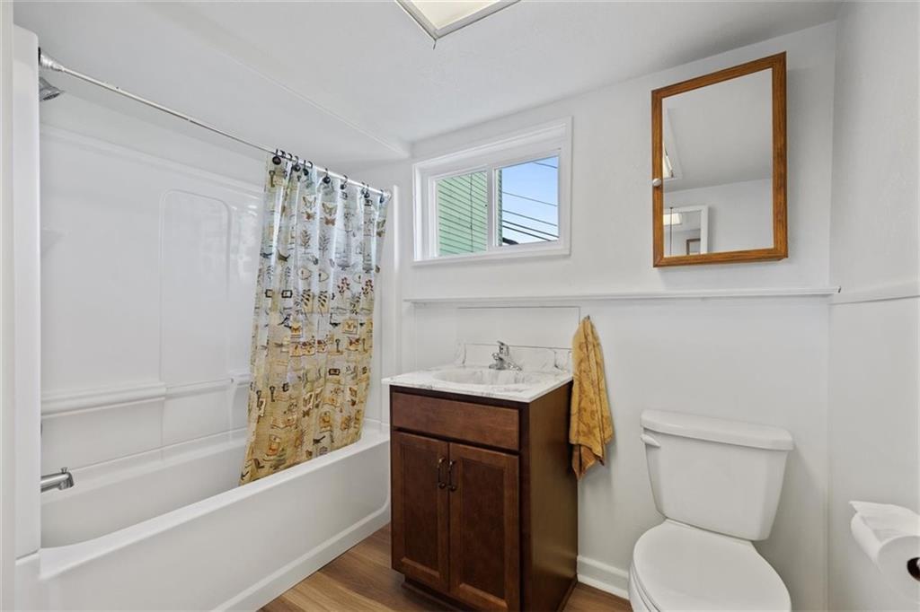 39 Eleanor Street Pittsburgh, PA 15203 - Photo 13 of 25 a bathroom with a toilet a sink and bathtub