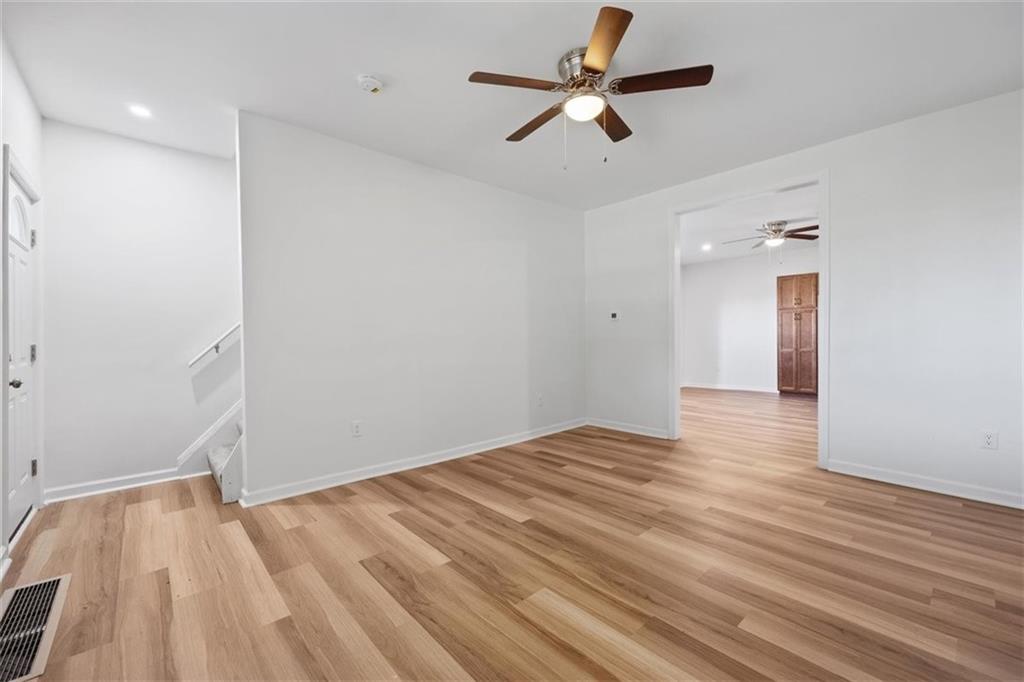 39 Eleanor Street Pittsburgh, PA 15203 - Photo 7 of 25 an empty room with wooden floor and windows