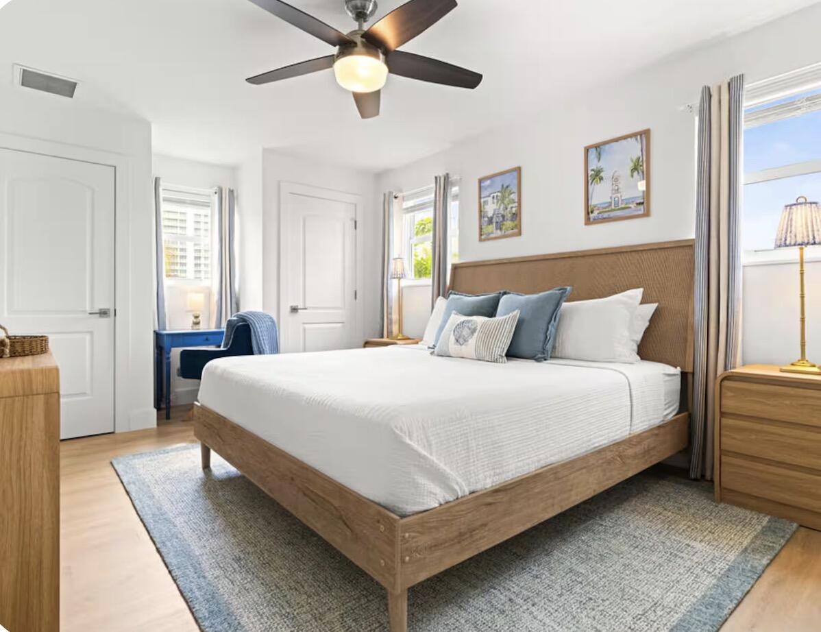 1216 Surf Road Singer Island, FL 33404 - Photo 6 of 15 a bedroom with a bed and window