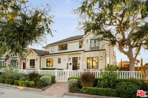 front view of a house with a garden