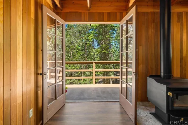 a view of a porch with wooden floor and a window