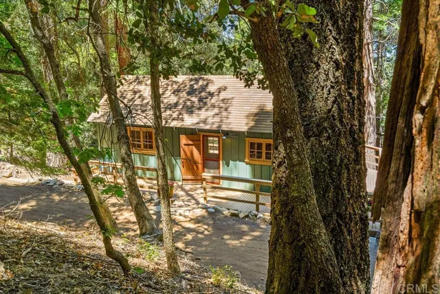 a view of a house with a tree