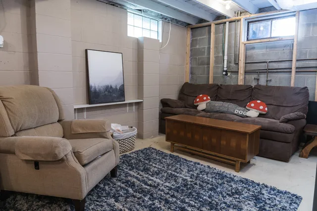 a living room with furniture and a window