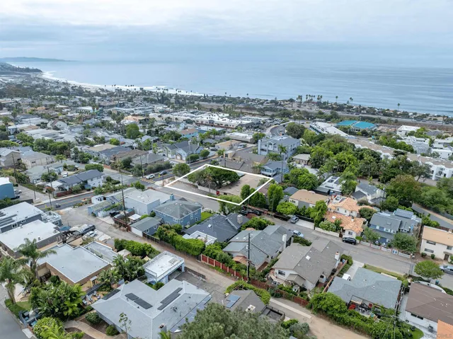 an aerial view of a city with lots of residential buildings