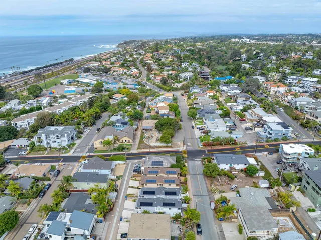 an aerial view of residential building and lake