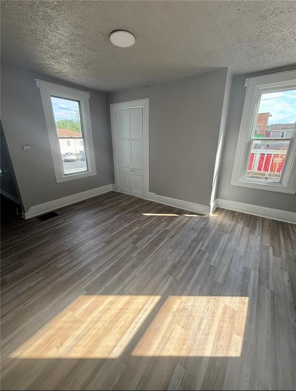 14 East Pike Street Houston, PA 15342 - Photo 2 of 8 a view of an empty room with wooden floor and a window