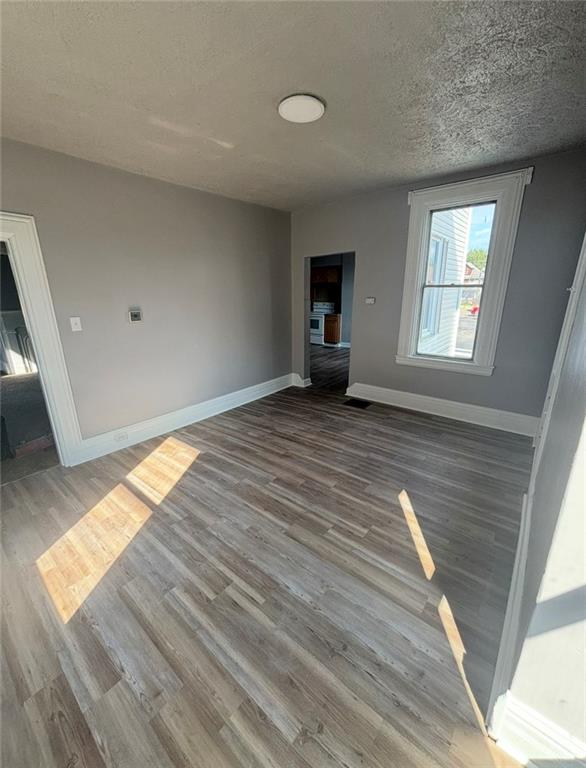 14 East Pike Street Houston, PA 15342 - Photo 4 of 8 a view of an empty room with wooden floor and a window