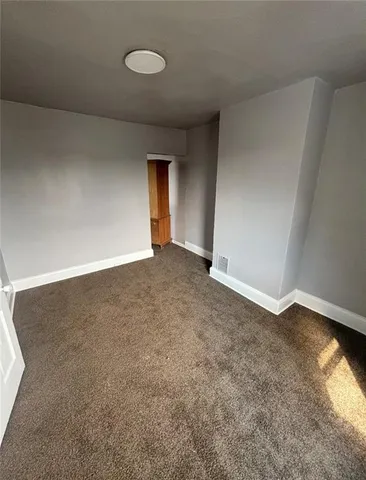 an empty room with a natural light