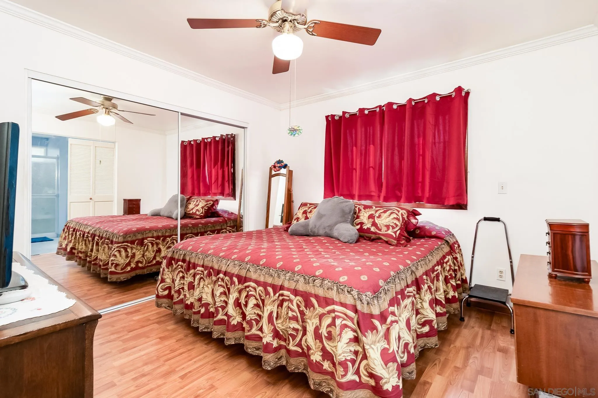 8423 Prospect Avenue Santee, CA 92071 - Photo 12 of 30 a bedroom with bed and a chandelier