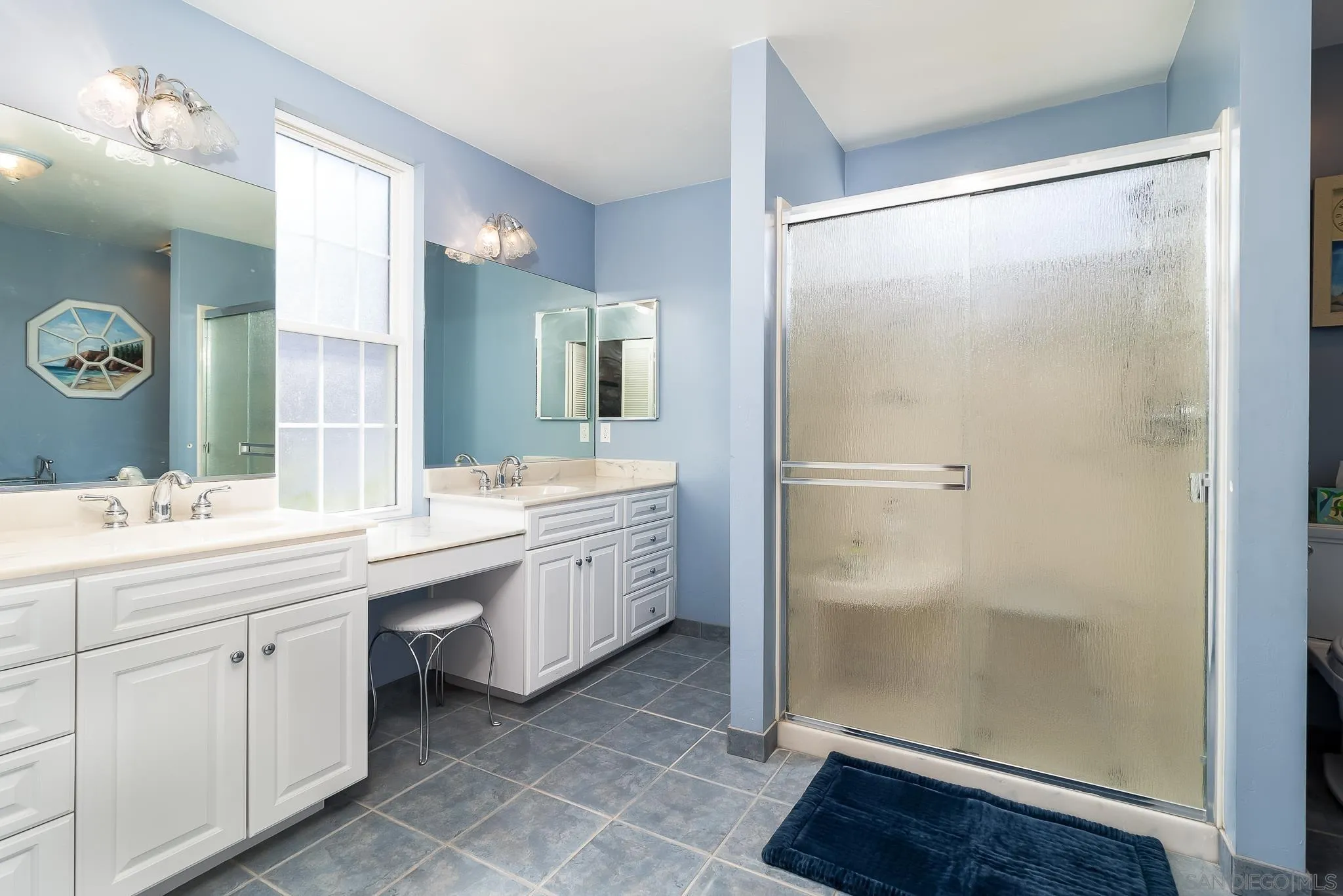 8423 Prospect Avenue Santee, CA 92071 - Photo 14 of 30 a bathroom with a double vanity sink mirror and shower