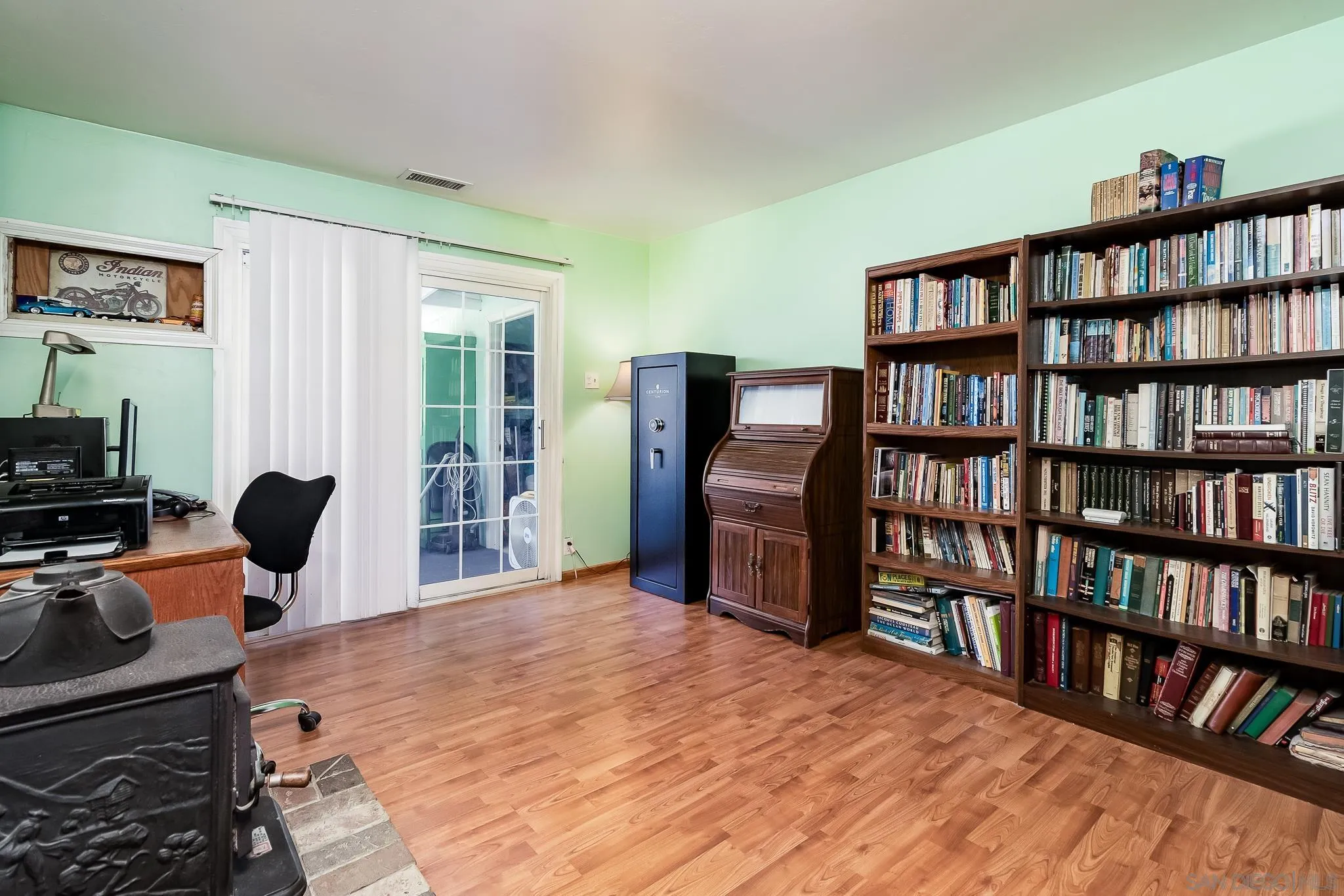 8423 Prospect Avenue Santee, CA 92071 - Photo 15 of 30 a room with a bed and a book shelf