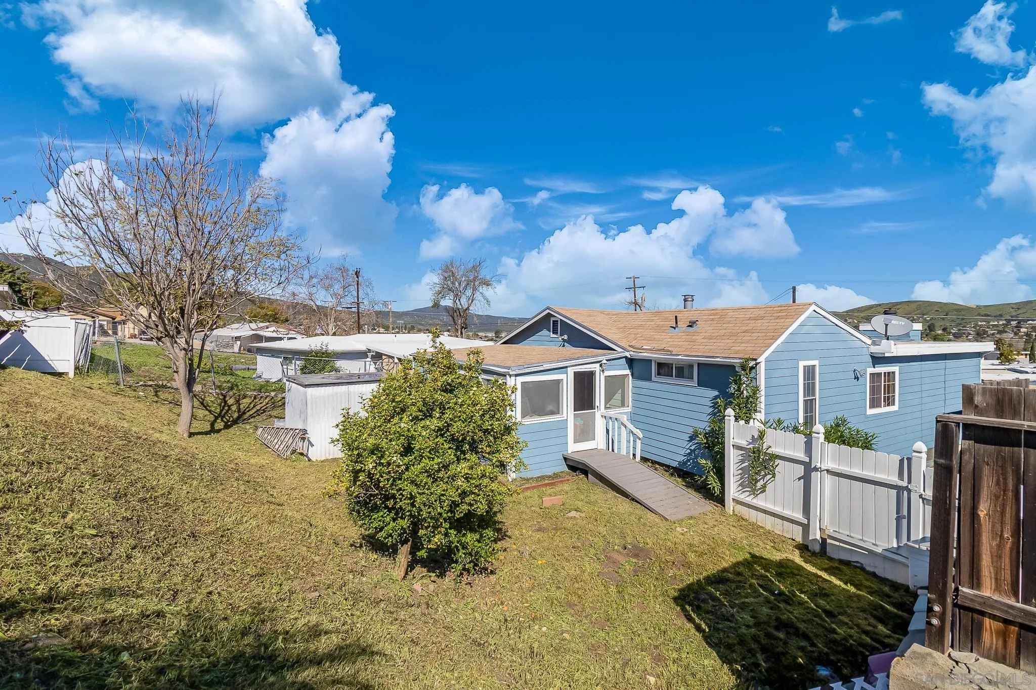 8423 Prospect Avenue Santee, CA 92071 - Photo 22 of 30 a view of a house with a yard