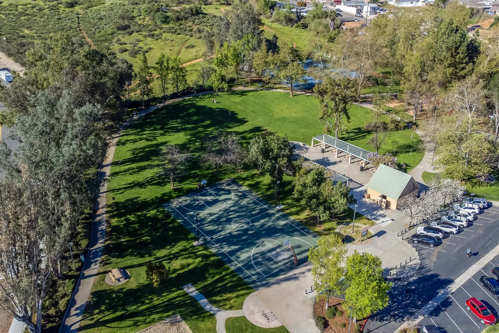 8423 Prospect Avenue Santee, CA 92071 - Photo 24 of 30 a view of a garden with lawn chairs under an umbrella