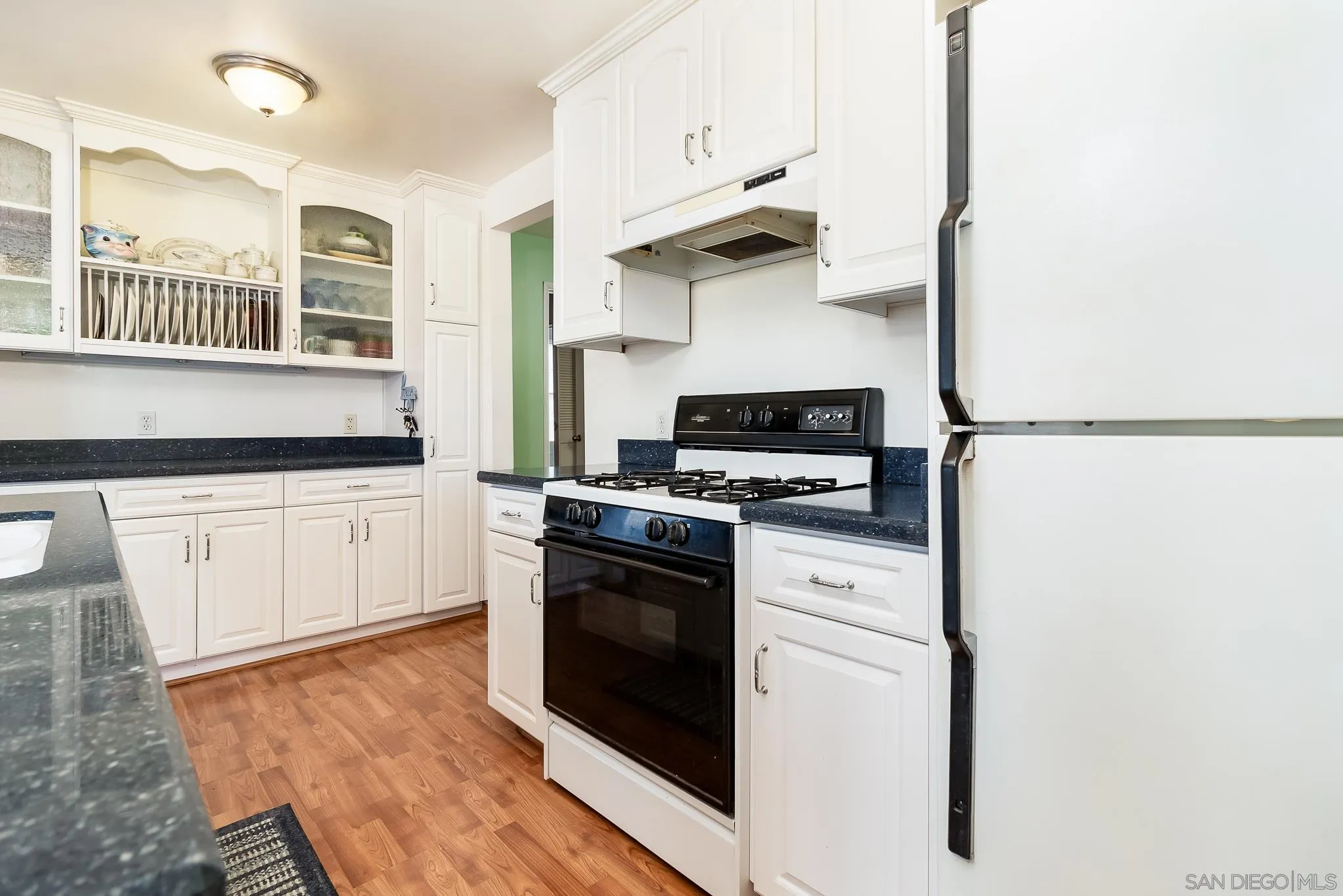 8423 Prospect Avenue Santee, CA 92071 - Photo 8 of 30 a kitchen with stainless steel appliances a stove microwave and a refrigerator