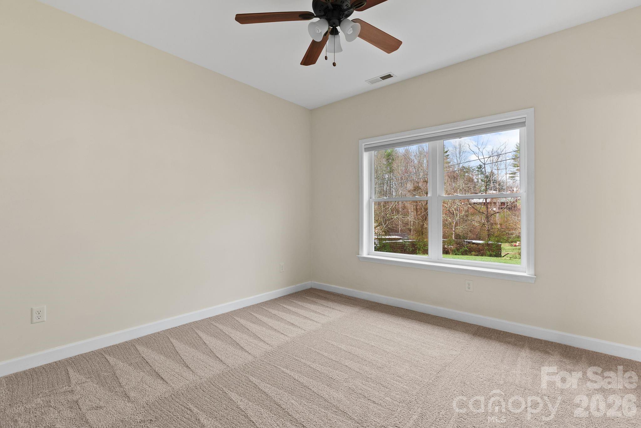 209 Breton Ridge Road Leicester, NC 28748 - Photo 13 of 34 an empty room with a window