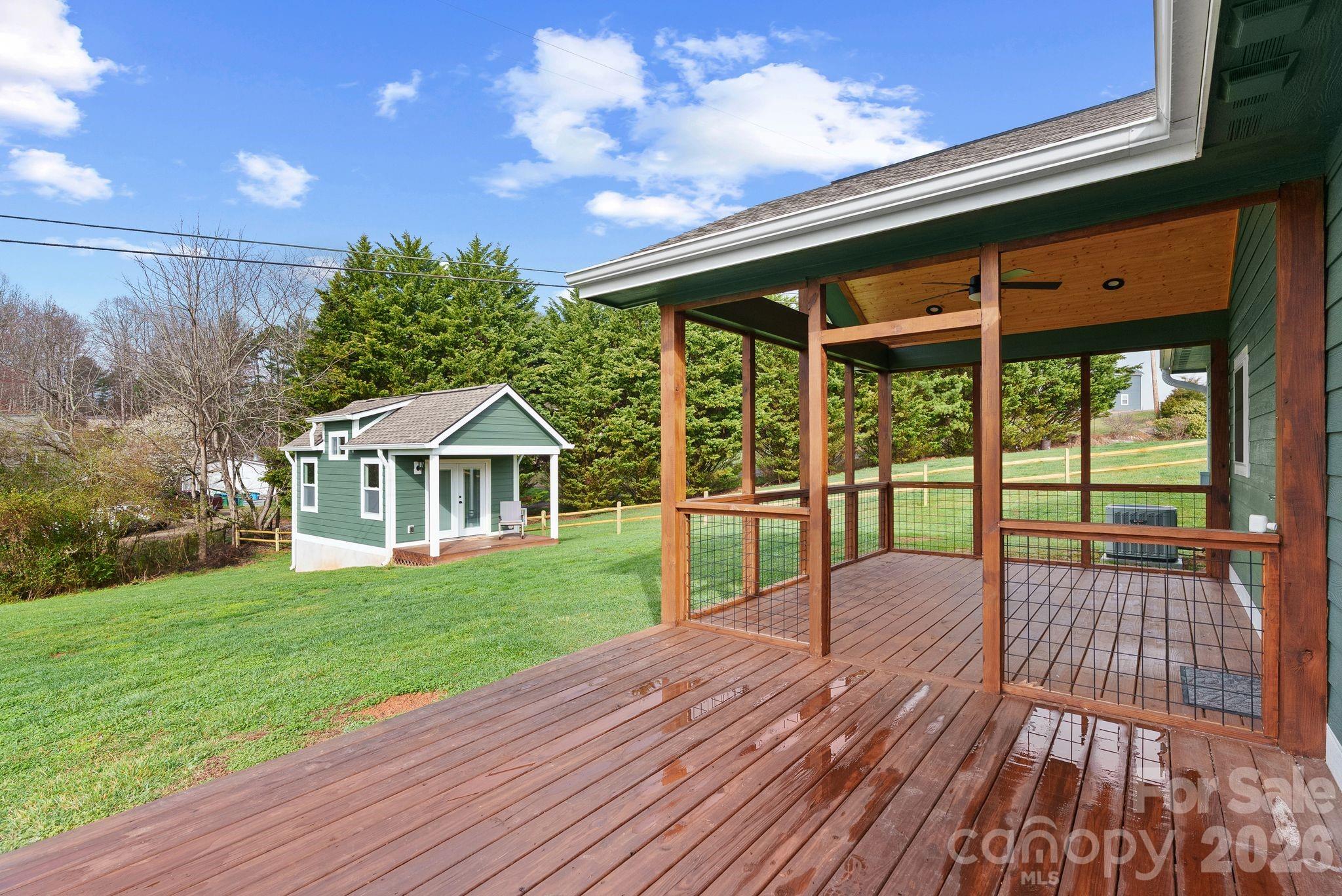 209 Breton Ridge Road Leicester, NC 28748 - Photo 19 of 34 a view of a house with a yard
