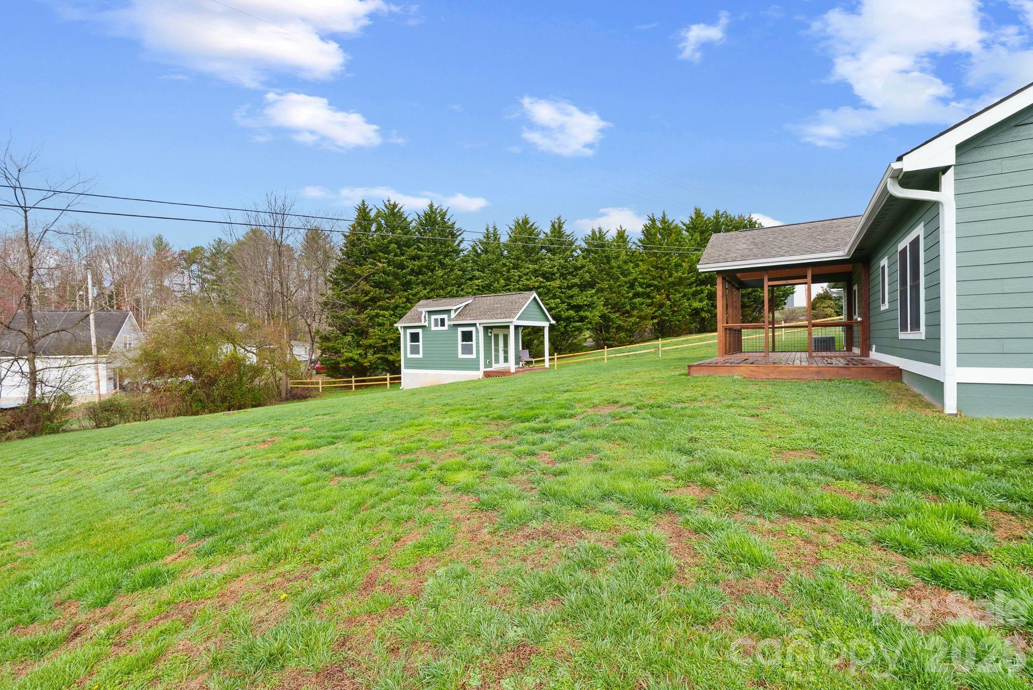 209 Breton Ridge Road Leicester, NC 28748 - Photo 26 of 34 a front view of a house with garden