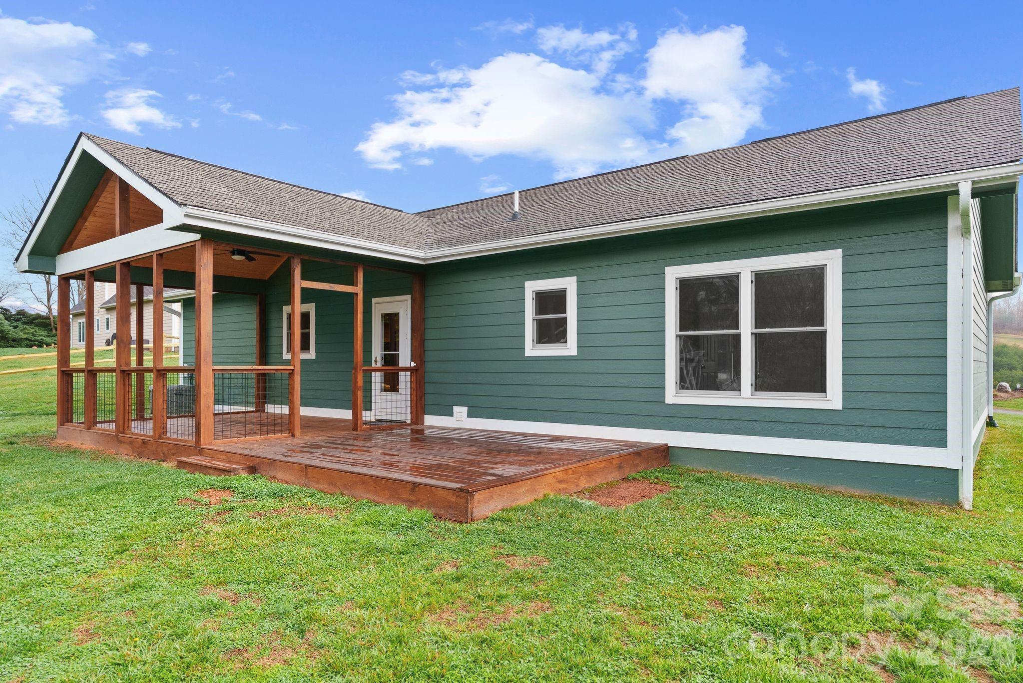 209 Breton Ridge Road Leicester, NC 28748 - Photo 4 of 34 a view of a house with backyard and porch
