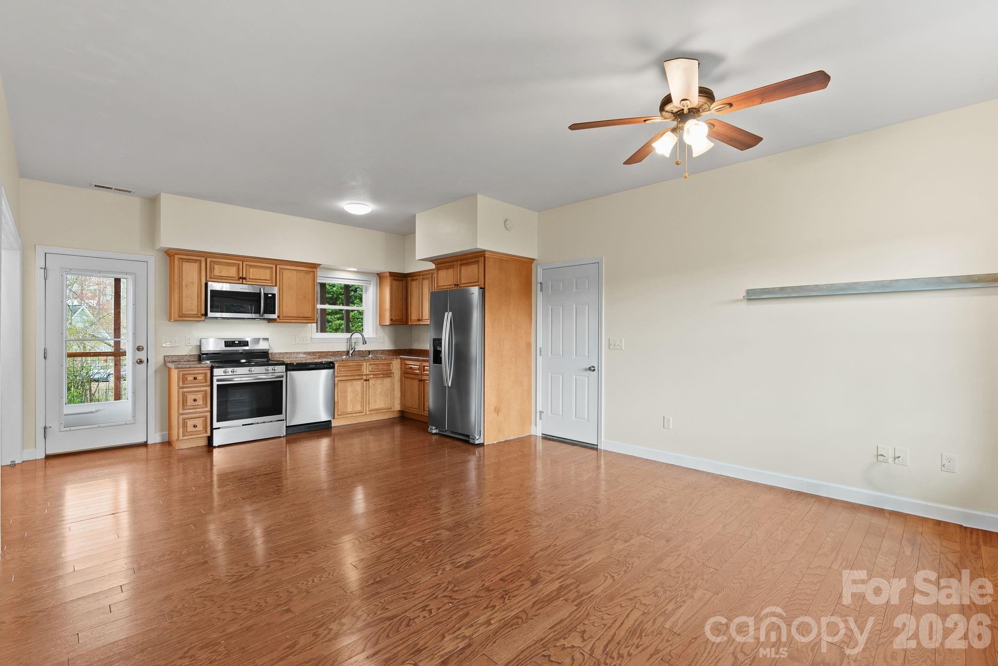 209 Breton Ridge Road Leicester, NC 28748 - Photo 7 of 34 a view of kitchen with sink microwave and refrigerator