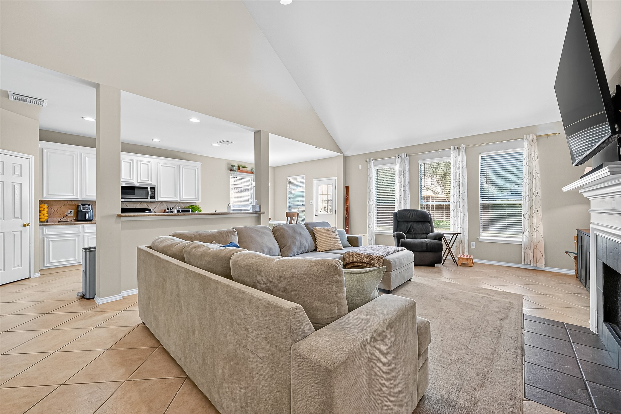 6019 Gablestone Lane Katy, TX 77450 - Photo 6 of 29 a living room with furniture and a flat screen tv