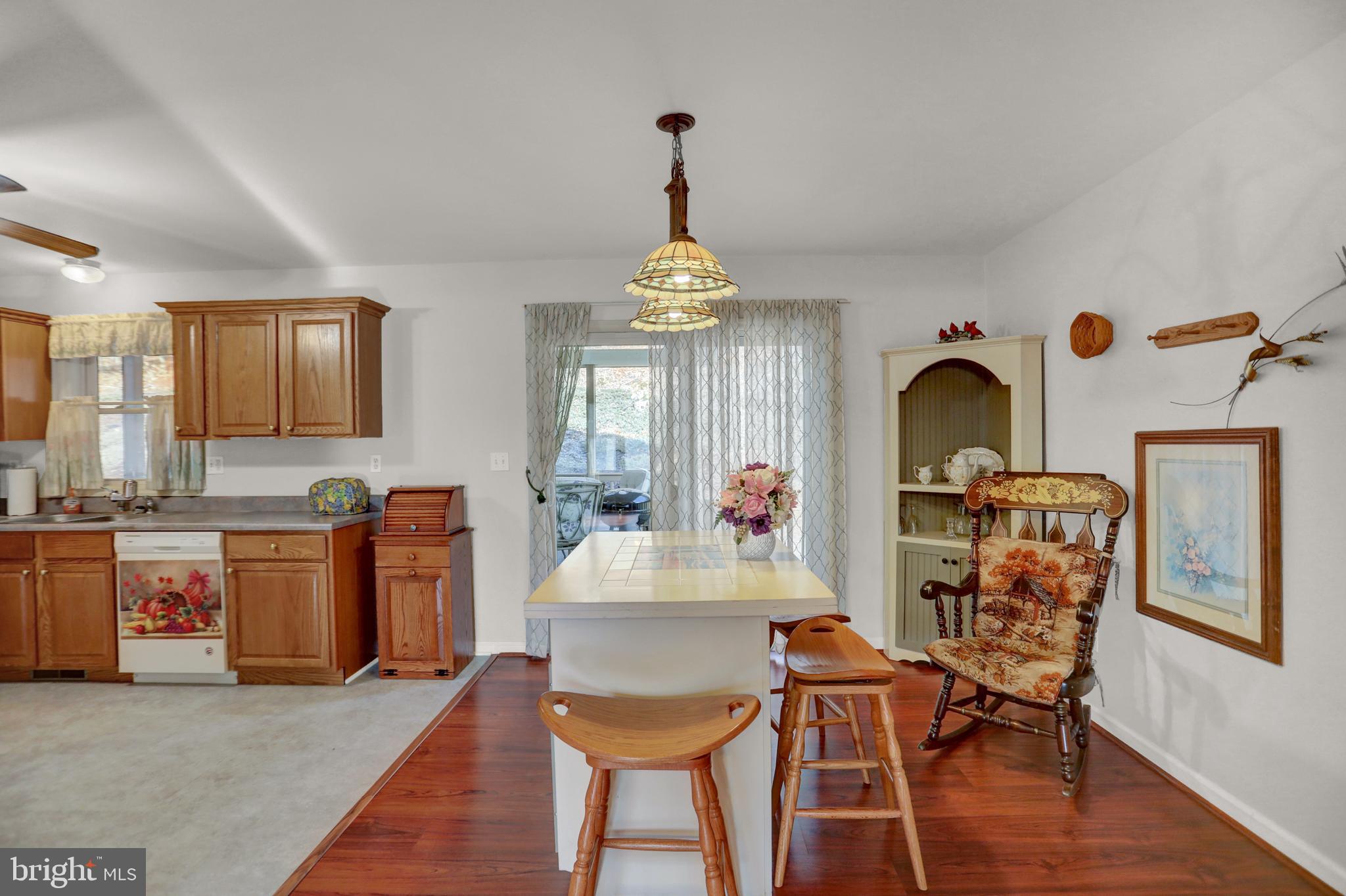 137 Rambo Hill Road Shermans Dale, PA 17090 - Photo 7 of 43 DINING AREA OPENS TO ENCLOSED PORCH