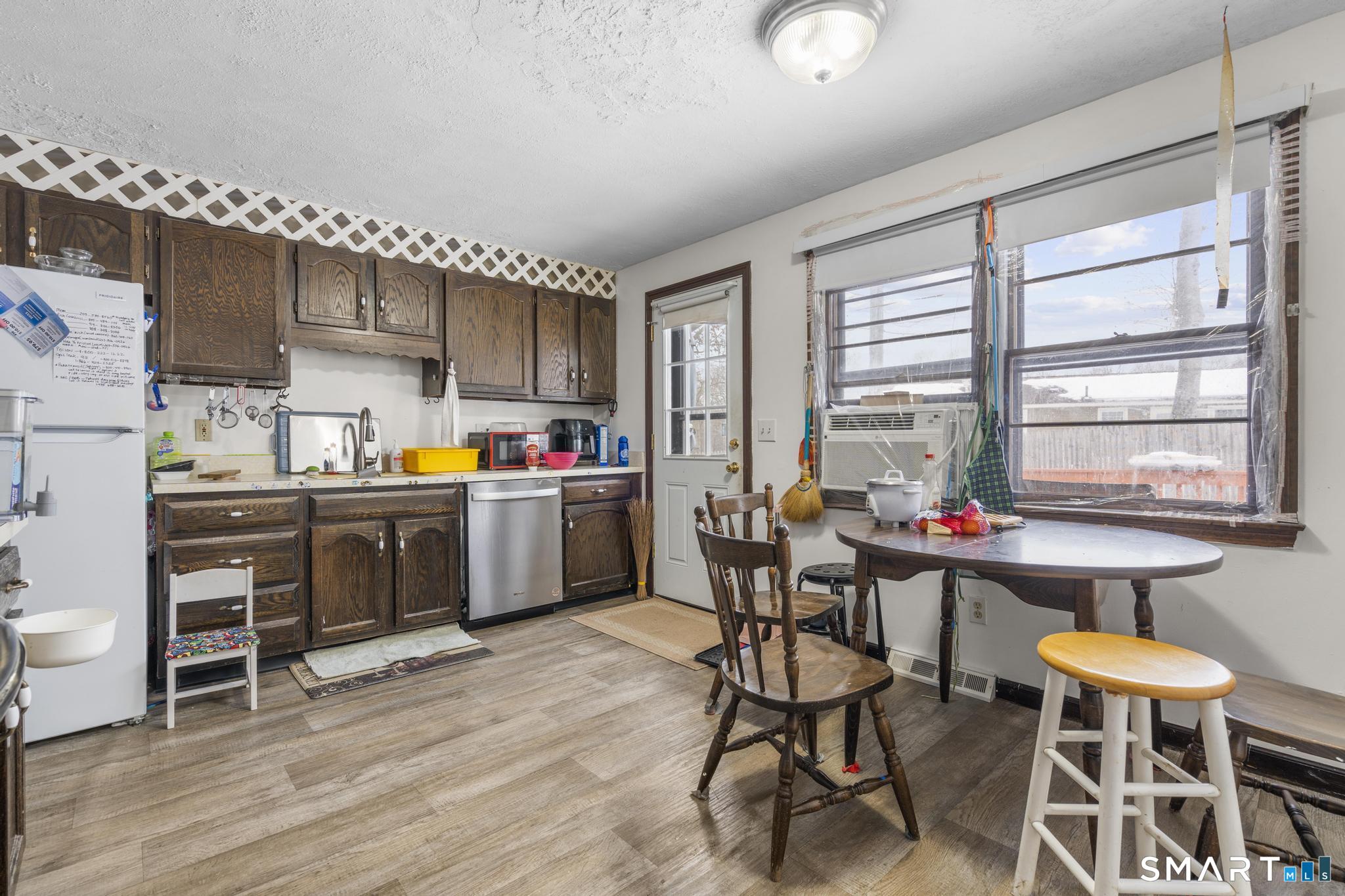133 Stevenson Road Meriden, CT 06451 - Photo 12 of 30 a kitchen with a sink cabinets and window