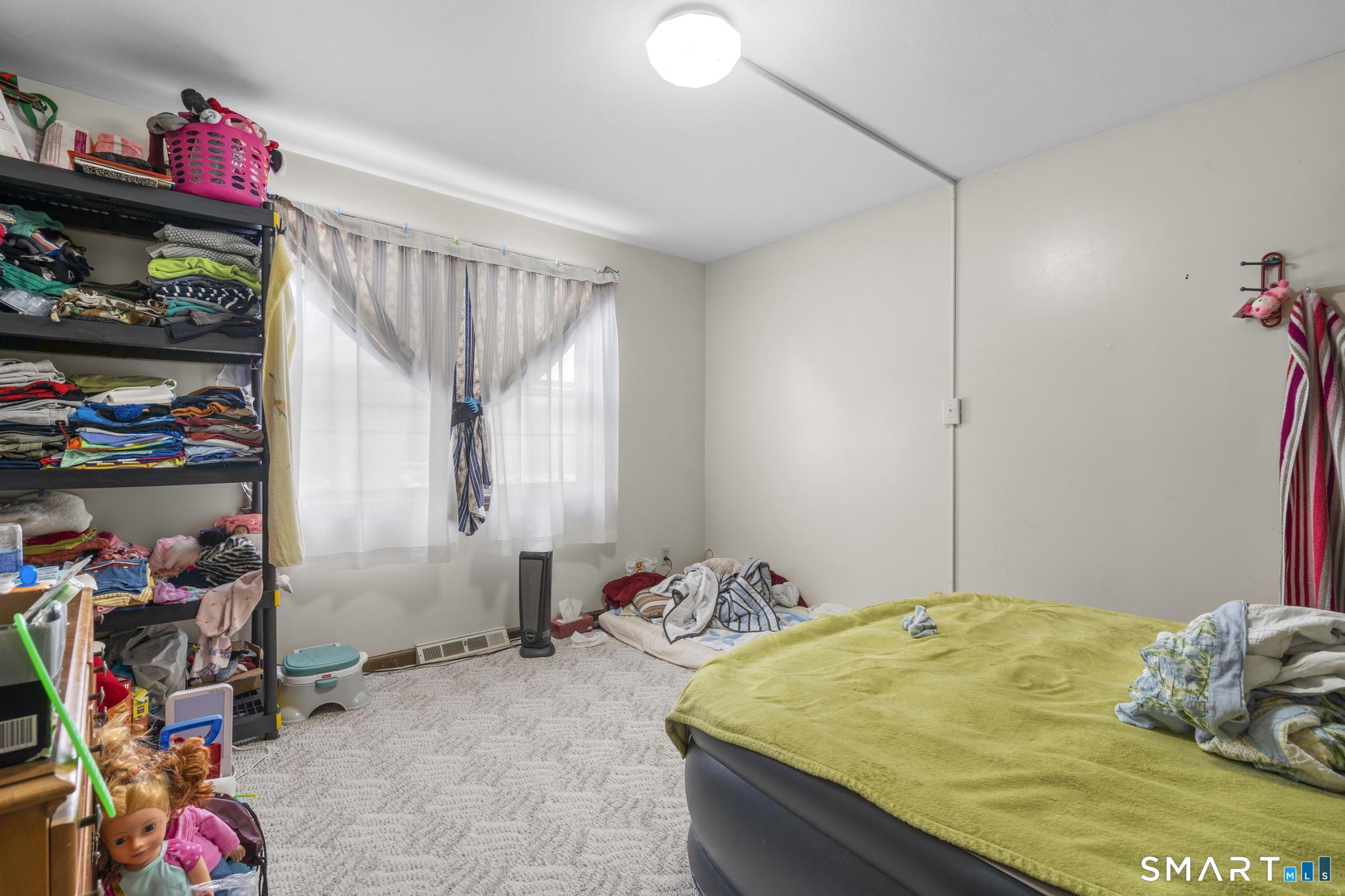 133 Stevenson Road Meriden, CT 06451 - Photo 19 of 30 a bedroom with a bed and a window