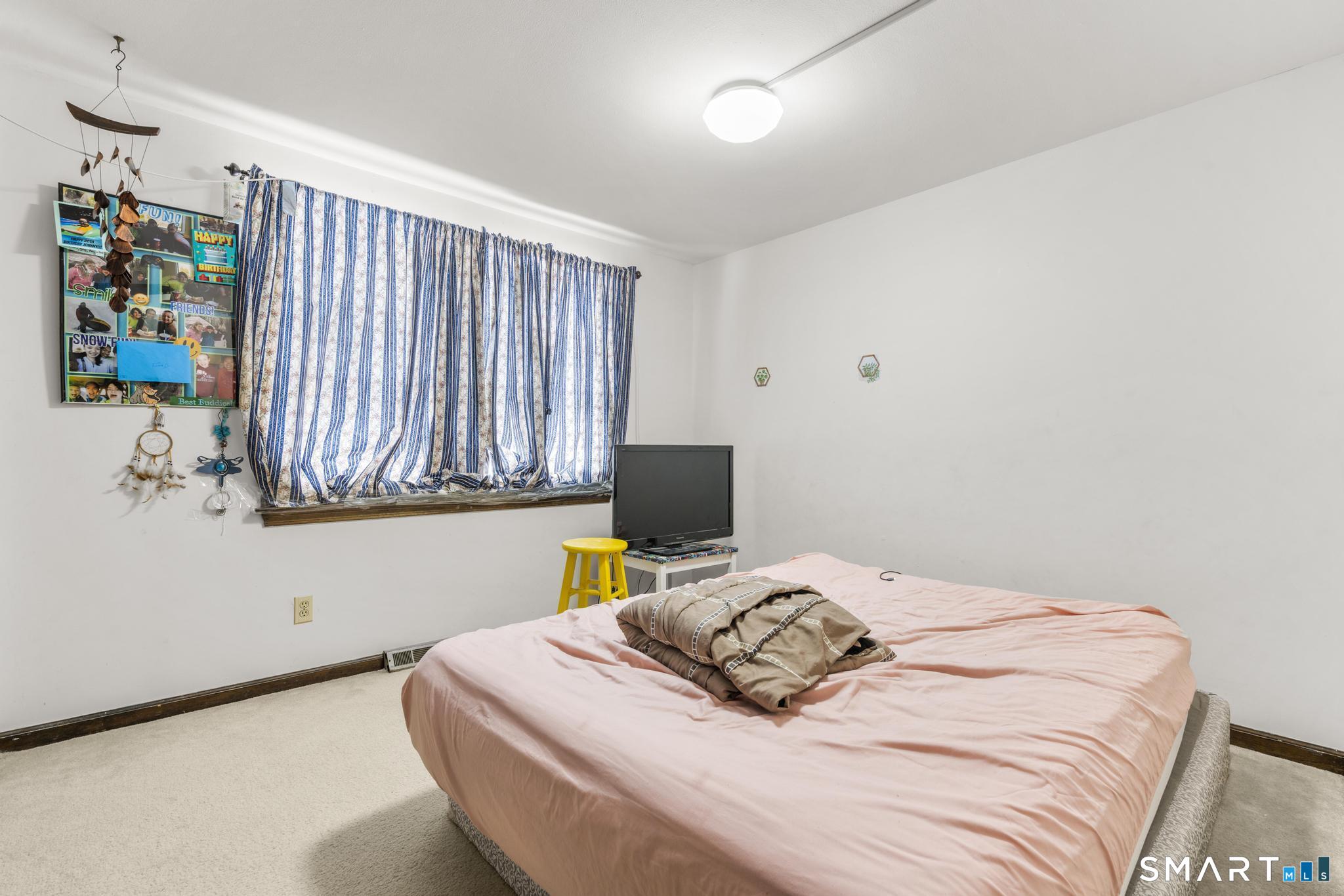 133 Stevenson Road Meriden, CT 06451 - Photo 22 of 30 a bedroom with a bed and a window