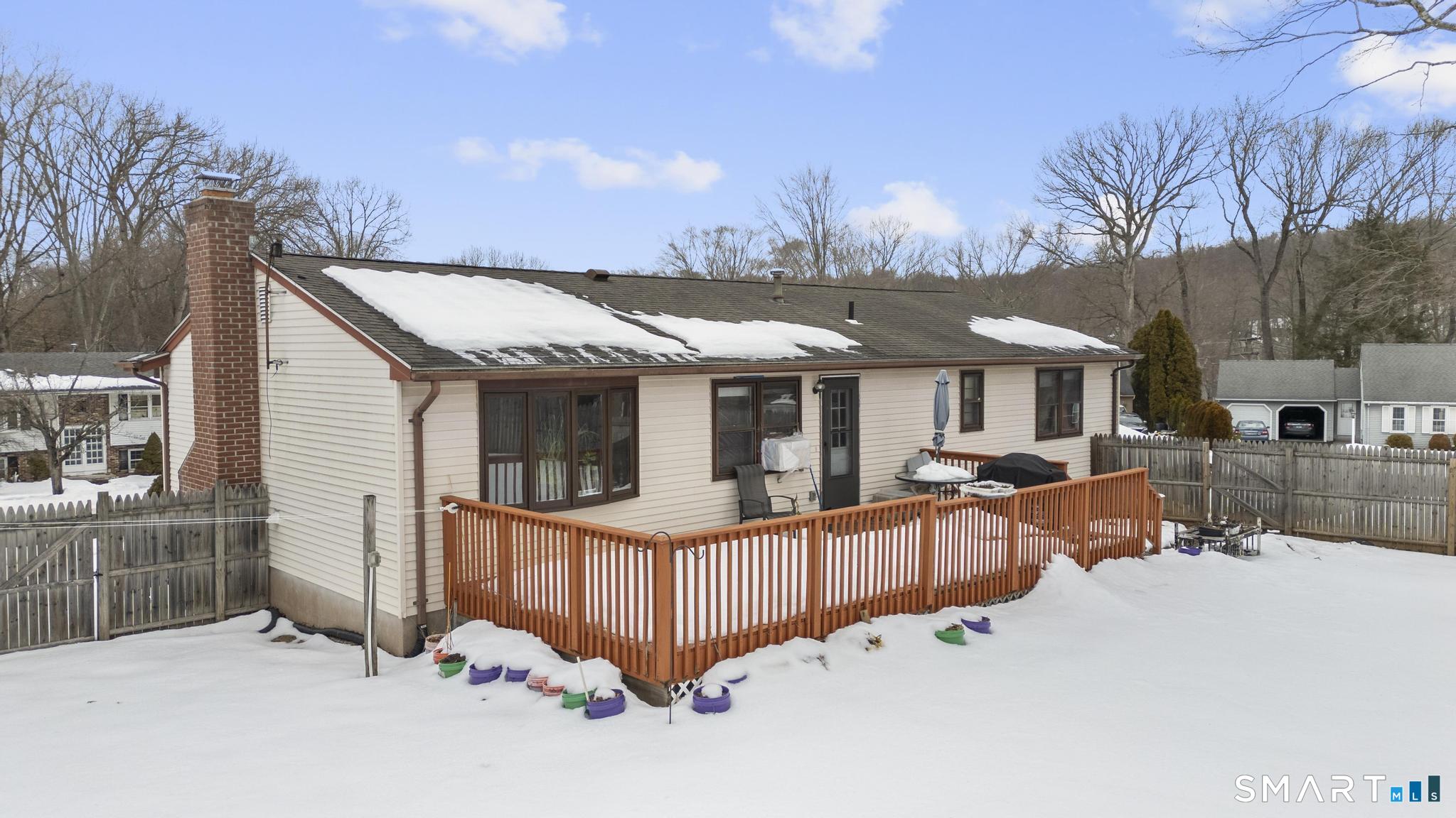 133 Stevenson Road Meriden, CT 06451 - Photo 4 of 30 a view of a house with wooden deck and furniture