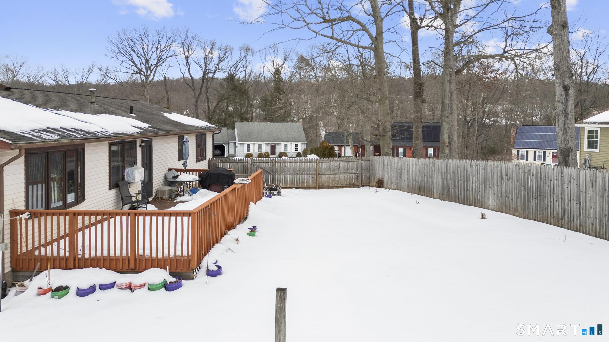 133 Stevenson Road Meriden, CT 06451 - Photo 5 of 30 a view of a house with a wooden fence
