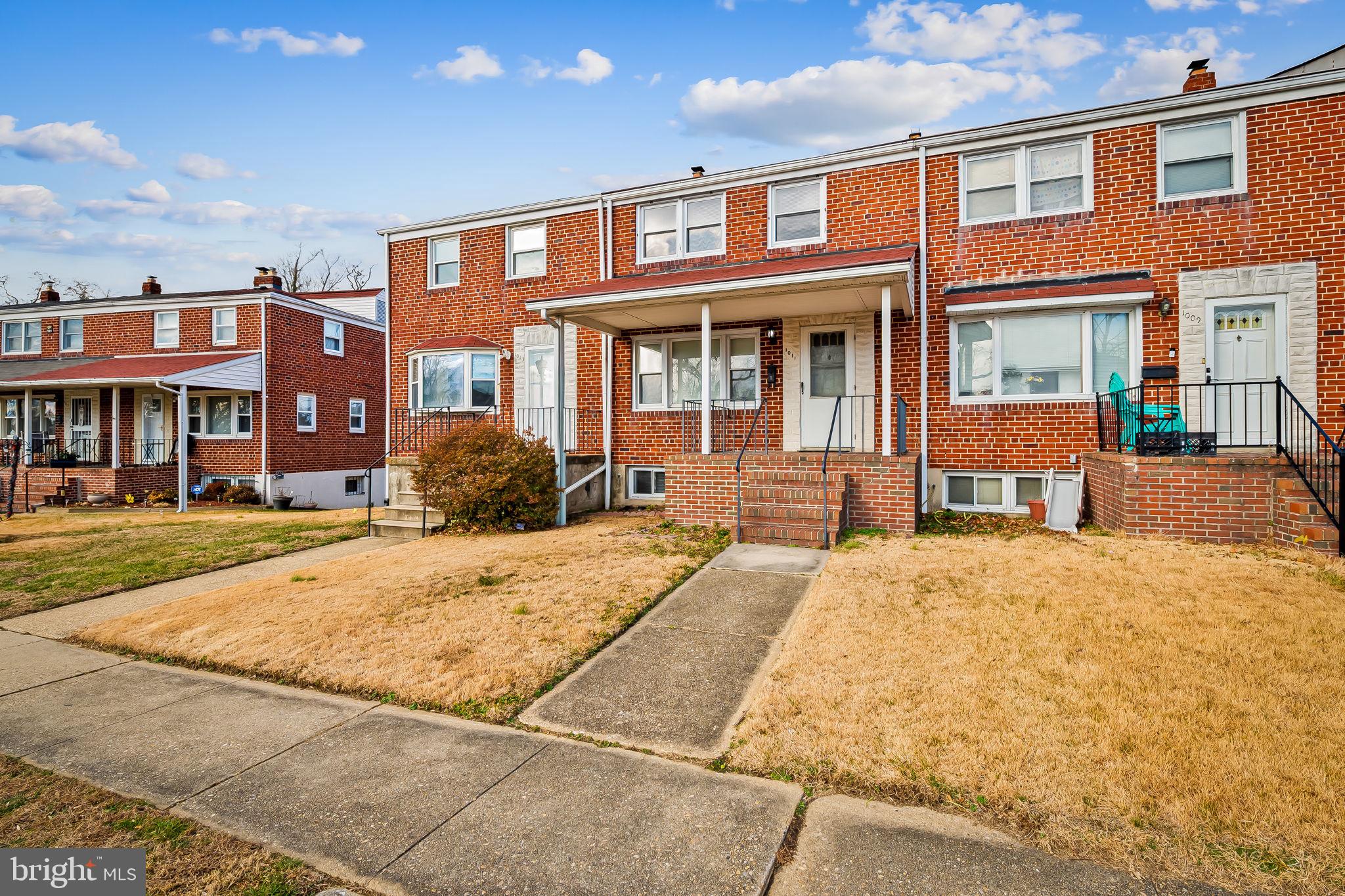 1011 Linden Avenue Baltimore, MD 21227 - Photo 2 of 40 a front view of a brick building with many windows