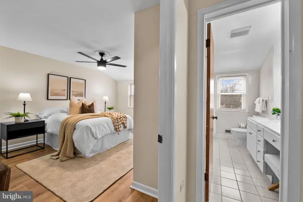 a bedroom with a bed and a mirror