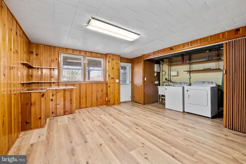 a view of a kitchen with wooden floor and a kitchen