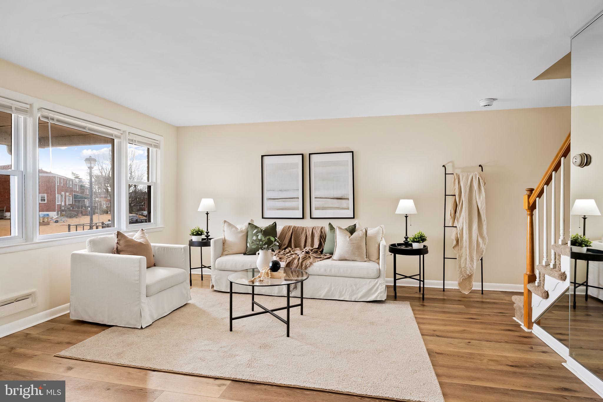 1011 Linden Avenue Baltimore, MD 21227 - Photo 5 of 40 a living room with furniture and a large window