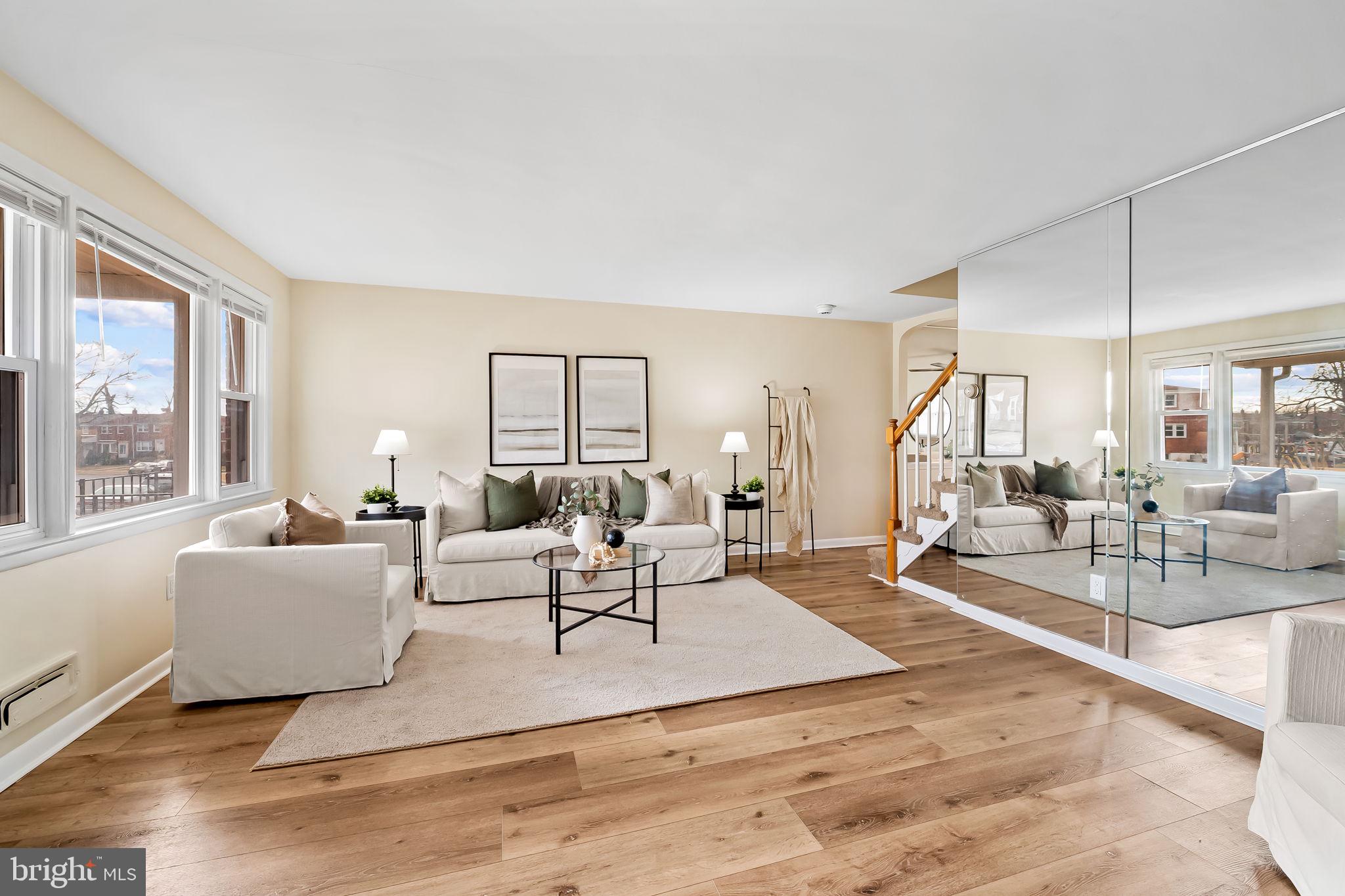1011 Linden Avenue Baltimore, MD 21227 - Photo 8 of 40 a living room with furniture and a large window