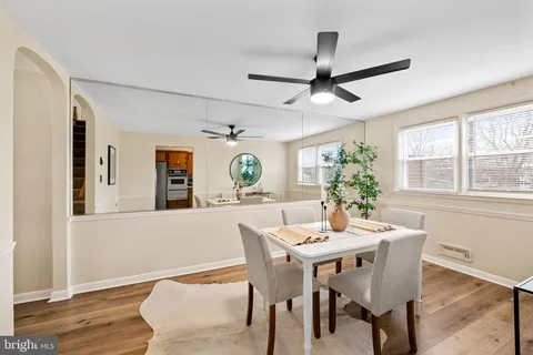 a dining room with furniture and window