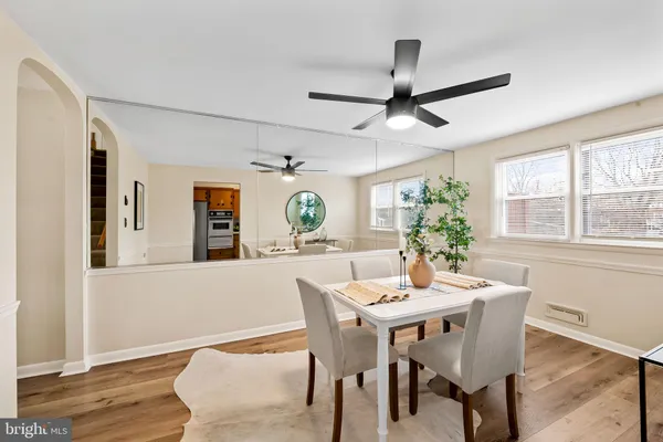 a dining room with furniture and window