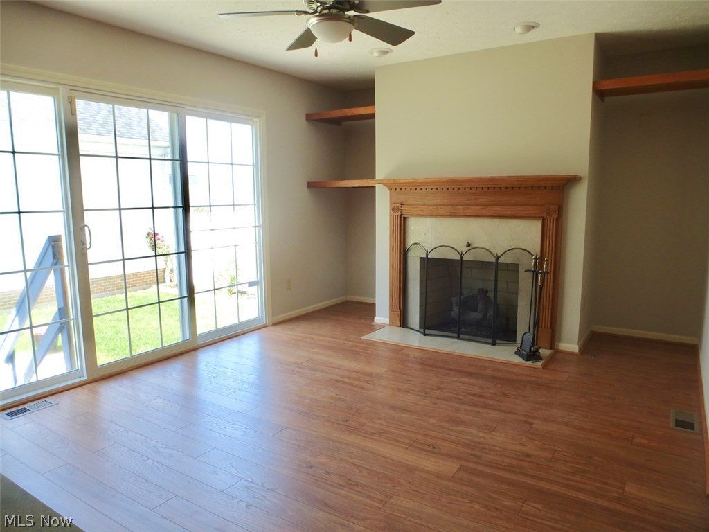 4433 Archer Road Cleveland, OH 44105 - Photo 10 of 26 Family room w/ new flooring & slider to patio